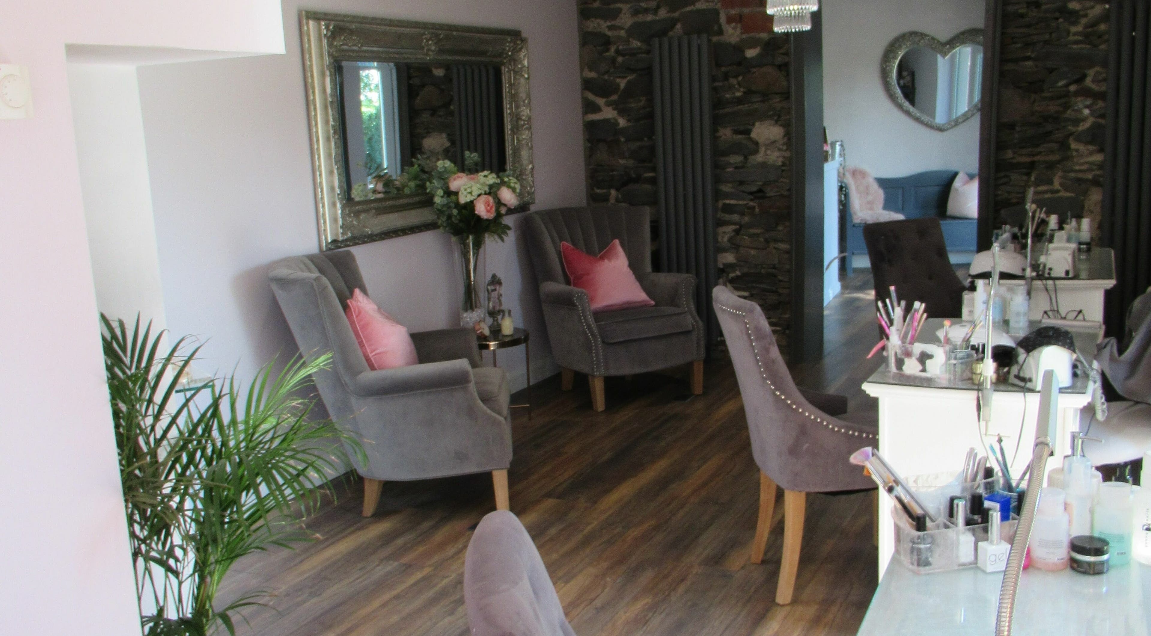 Elegant seating area at BeYOUtifi in Donaghadee, Northern Ireland, GB, with plush chairs and tasteful decor.