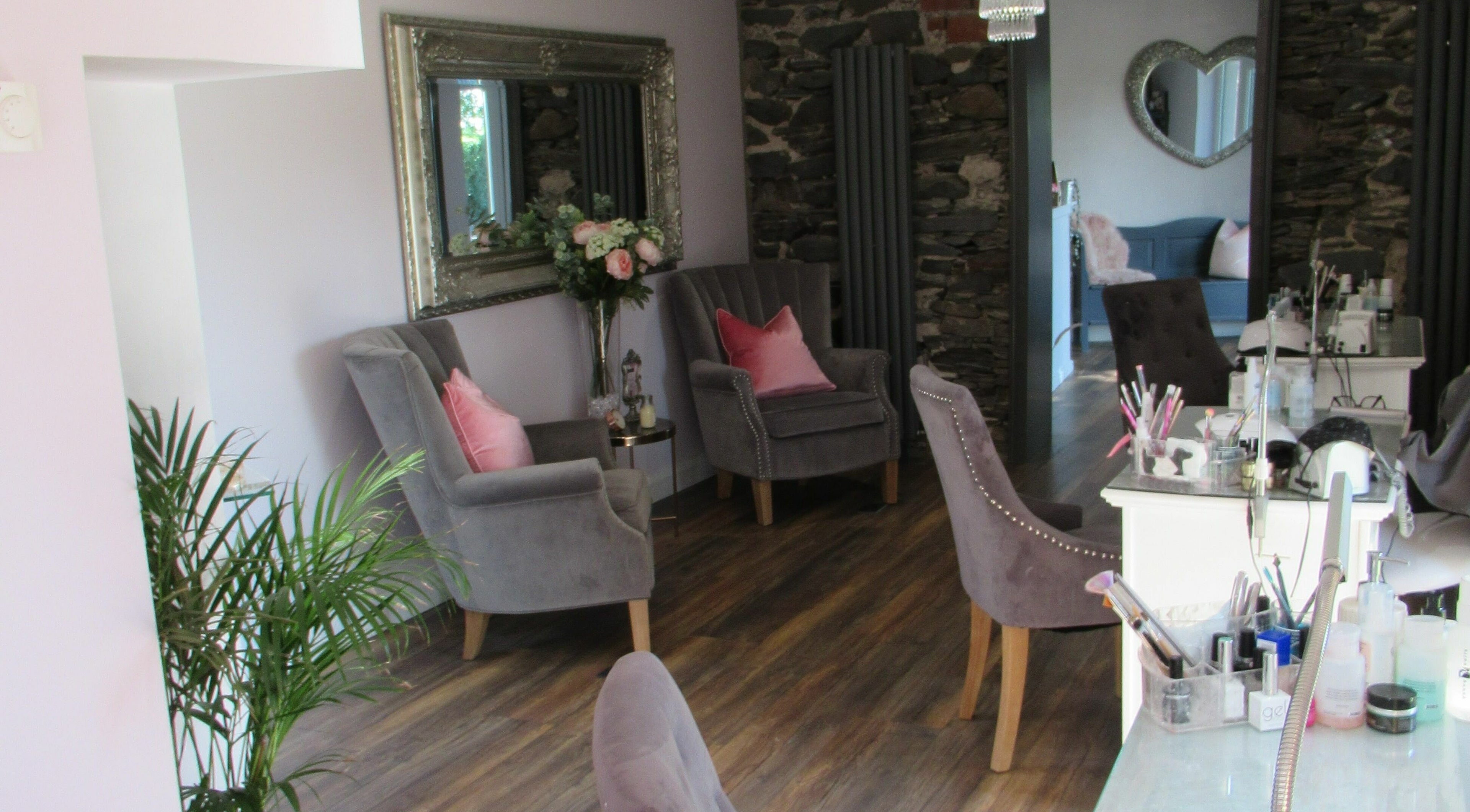 Elegant seating area at BeYOUtifi in Donaghadee, Northern Ireland, GB, with plush chairs and tasteful decor.