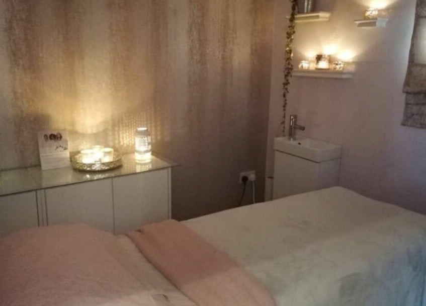 Relaxing treatment room at BeYOUtifi, Donaghadee, Northern Ireland, GB with ambient lighting and cozy decor.