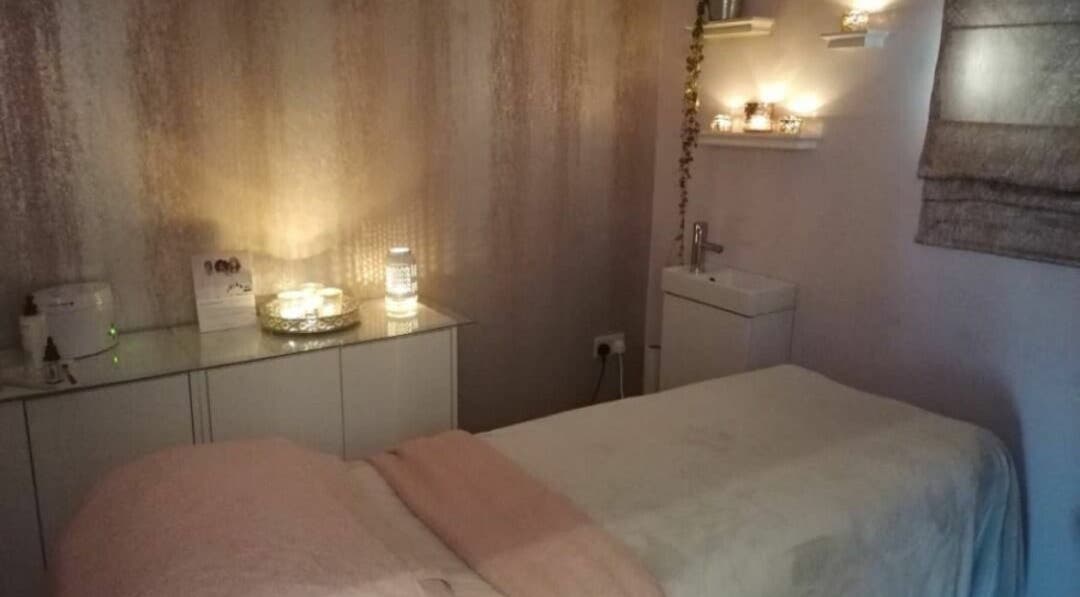 Relaxing treatment room at BeYOUtifi, Donaghadee, Northern Ireland, GB with ambient lighting and cozy decor.