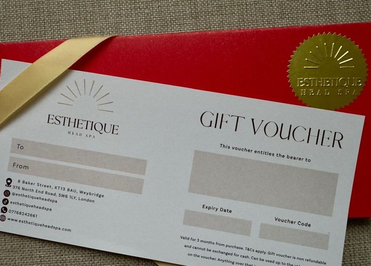 Gift voucher from Esthetique Head Spa Weybridge, England, GB, against a textured background.