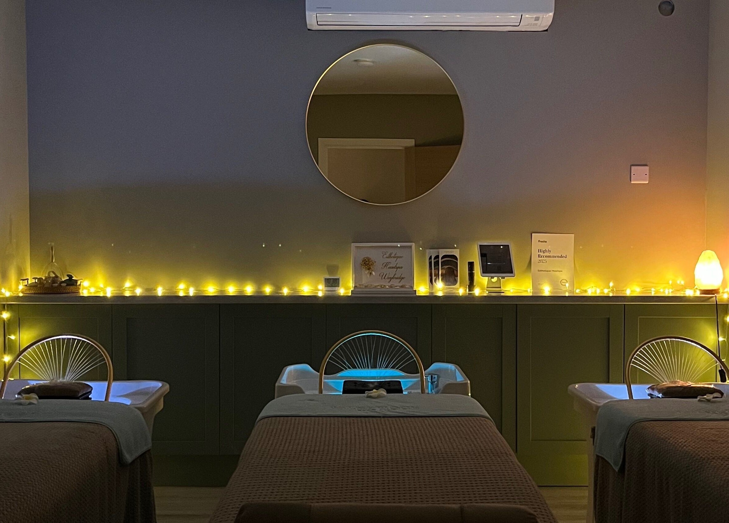 Peaceful treatment room at Esthetique Head Spa Weybridge, Weybridge, England, GB, with ambient lighting.