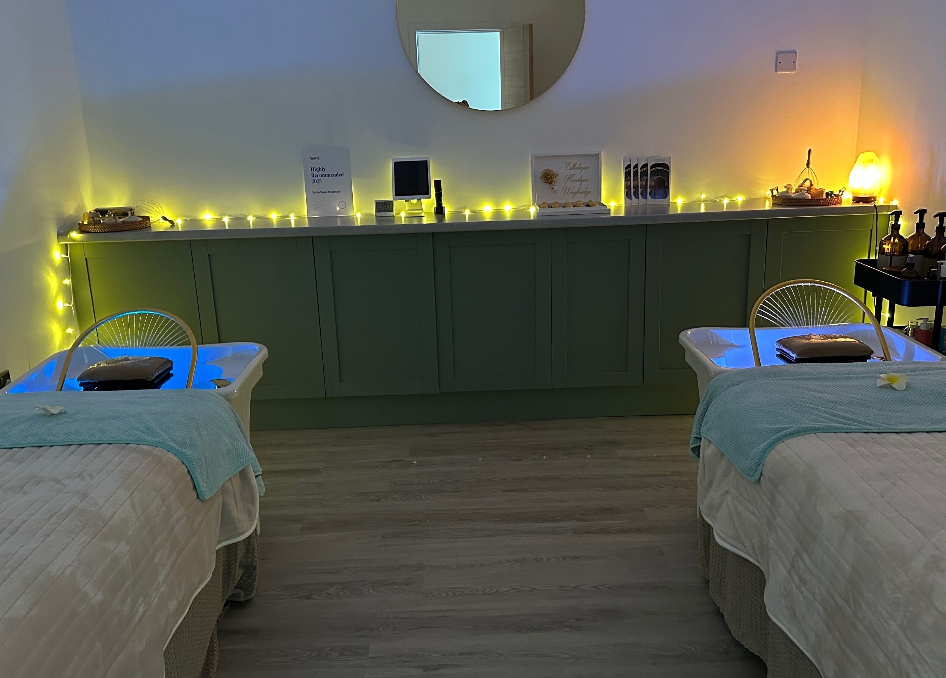 Relaxing treatment room at Esthetique Head Spa Weybridge in Weybridge, England, GB, with ambient lighting.