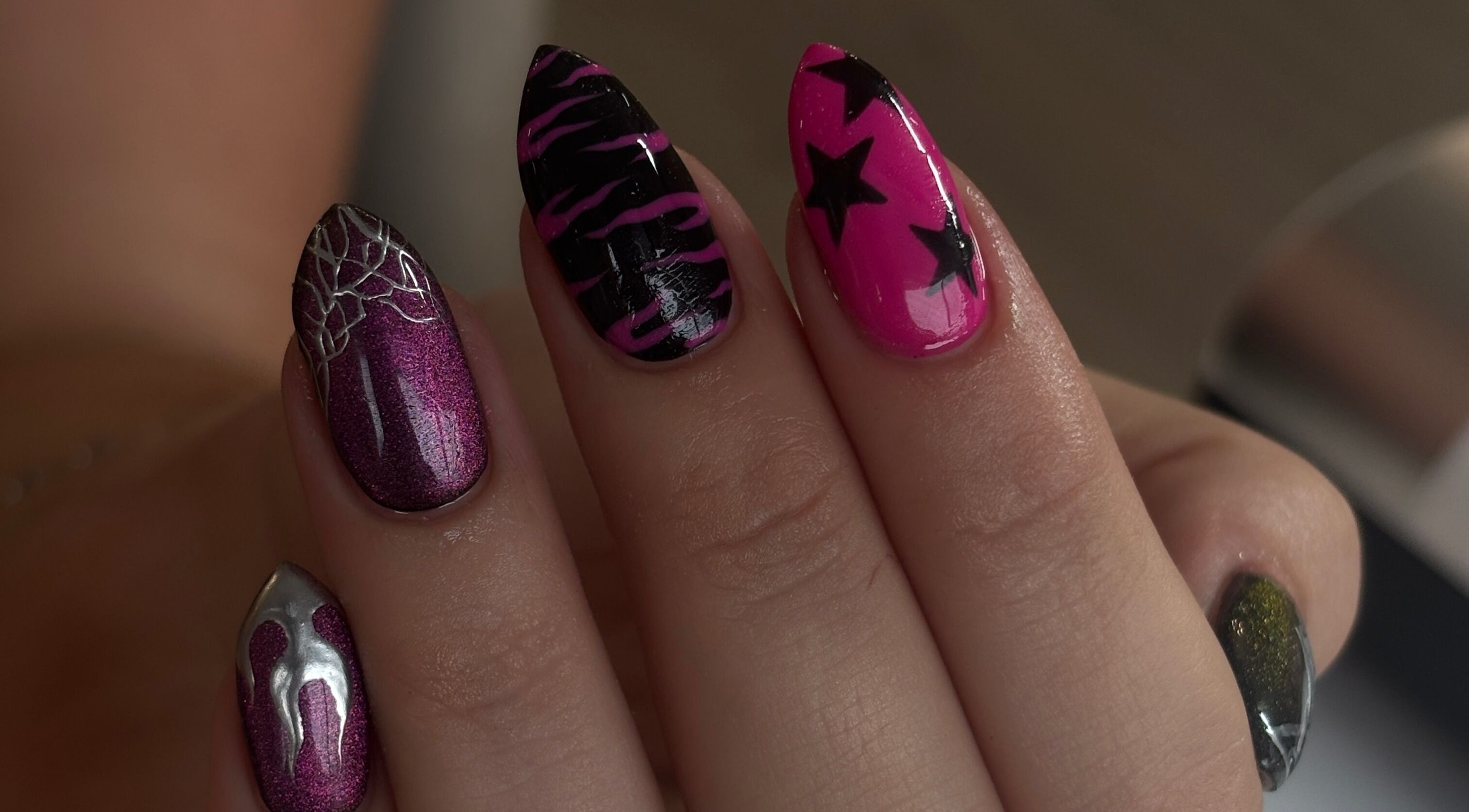 Vibrant star-themed nail art at Byoliviasophia, Prescot, England, GB.