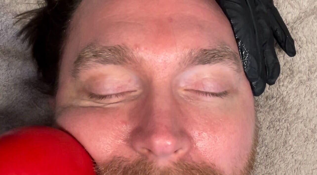 Man receiving a facial massage at Skin by Fran in Bath, England, GB, enhancing relaxation and skin health.