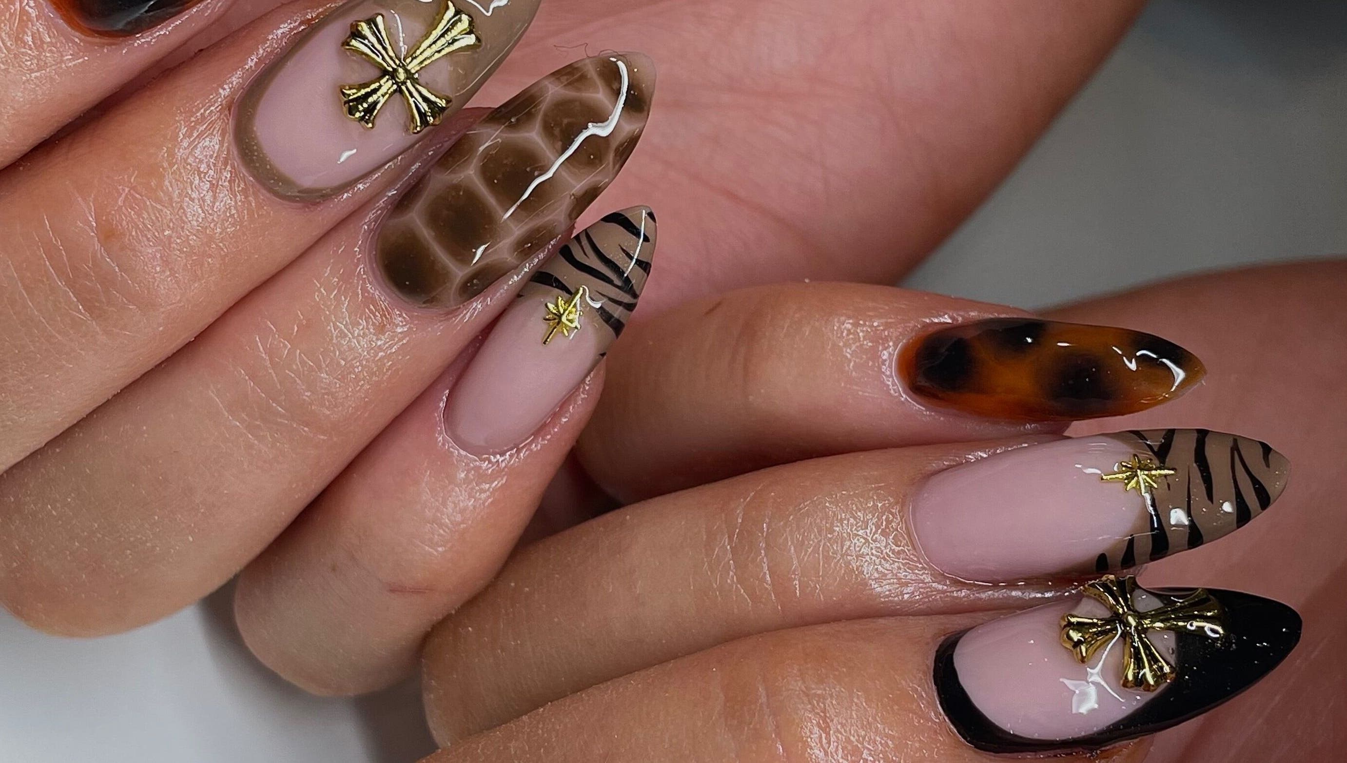 Stylish nail art with gold accents at Ninety Eight Nails in Glasgow, Scotland, GB.