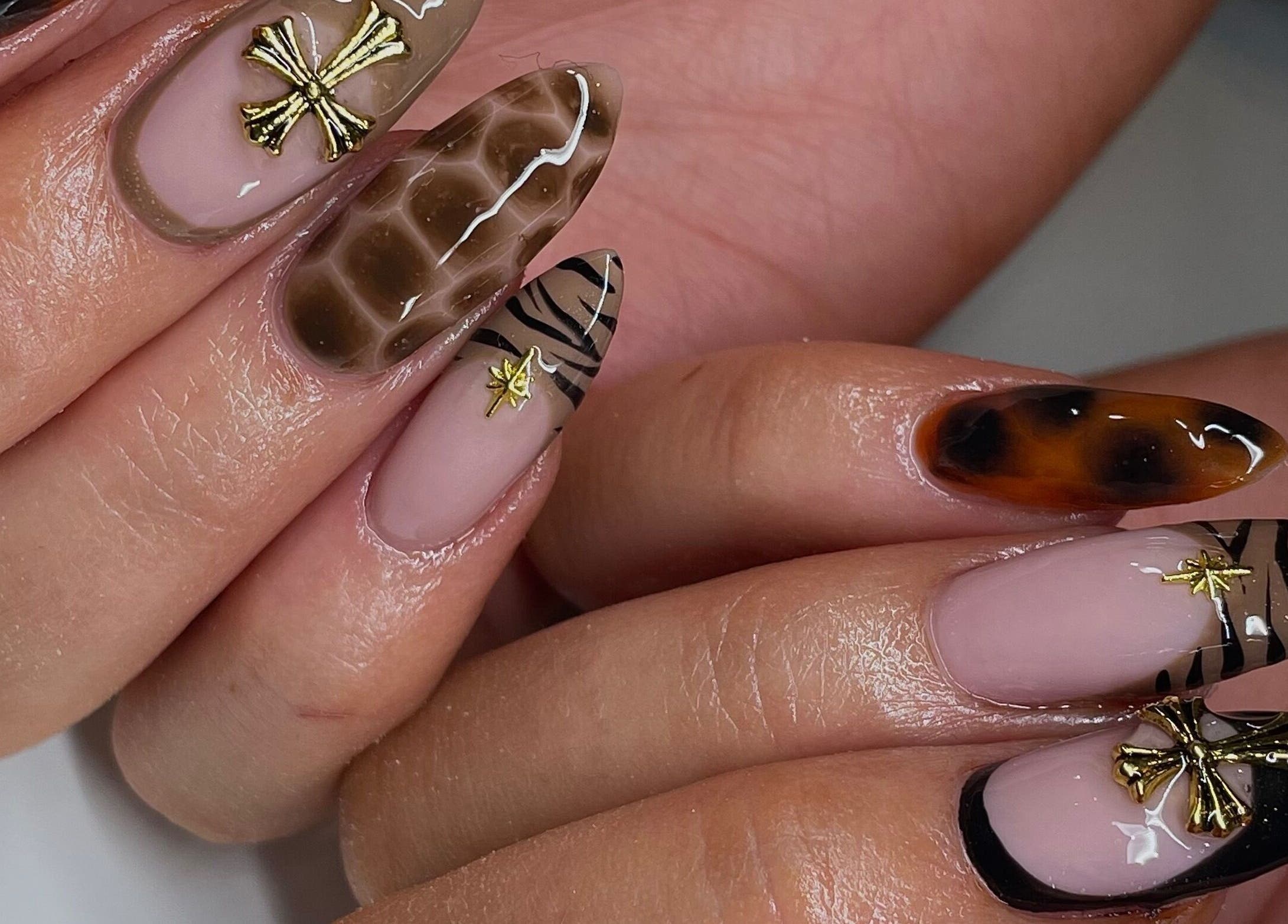 Stylish nail art with gold accents at Ninety Eight Nails in Glasgow, Scotland, GB.