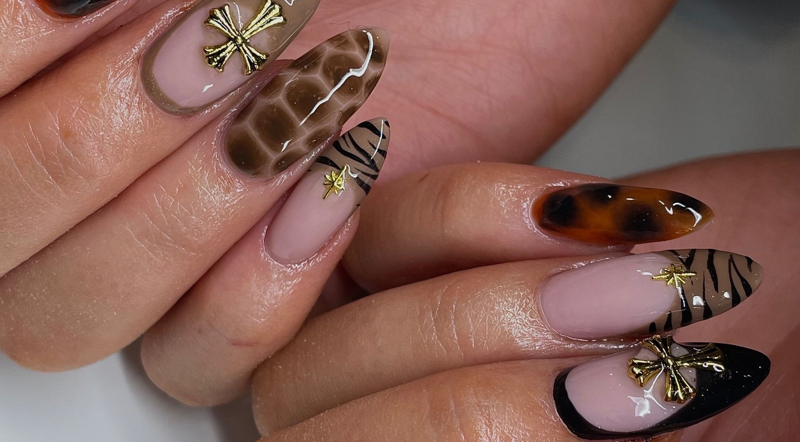 Stylish nail art with gold accents at Ninety Eight Nails in Glasgow, Scotland, GB.