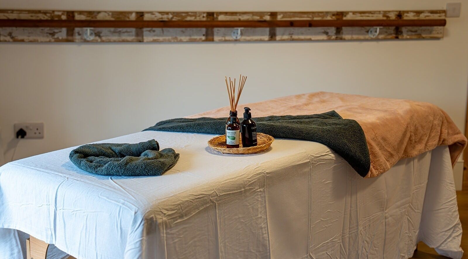 Massage table with oils at Anna Booth Massage & Yoga, Nailsworth, England, GB, providing a relaxing ambiance.