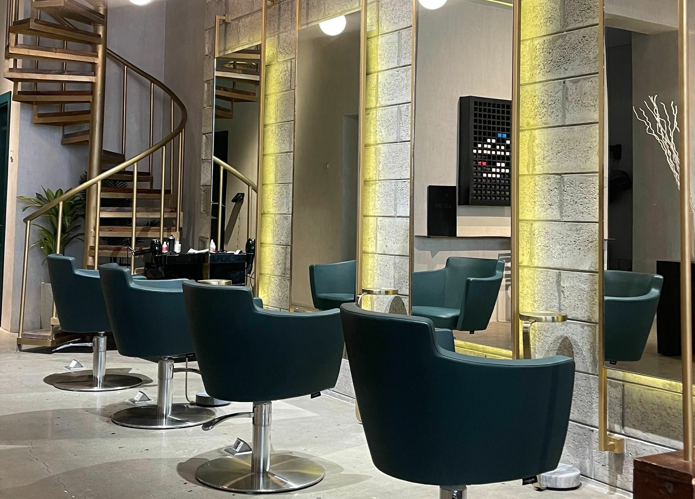 Elegant interior of Base Beauty Lounge I بيس بيوتي لاونج in Al Hofuf, Eastern Province, SA with stylish chairs.