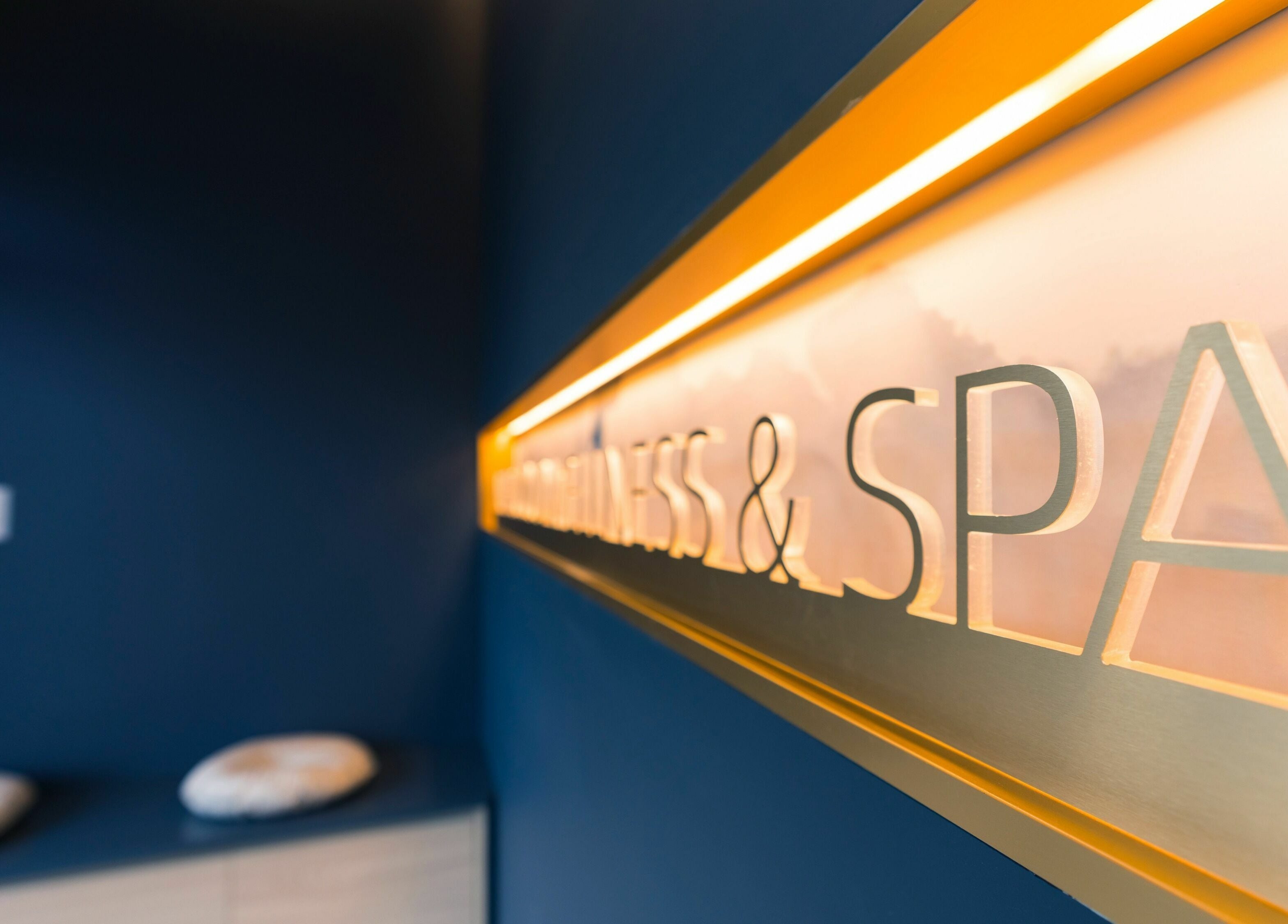 Illuminated spa signage at In The Cloud Spa, Toronto, Ontario, CA with elegant, soothing ambiance.
