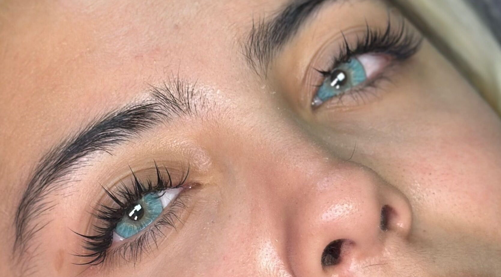 Close-up of perfectly groomed eyelashes at Siren by Kara Rose in Albuquerque, New Mexico, US.