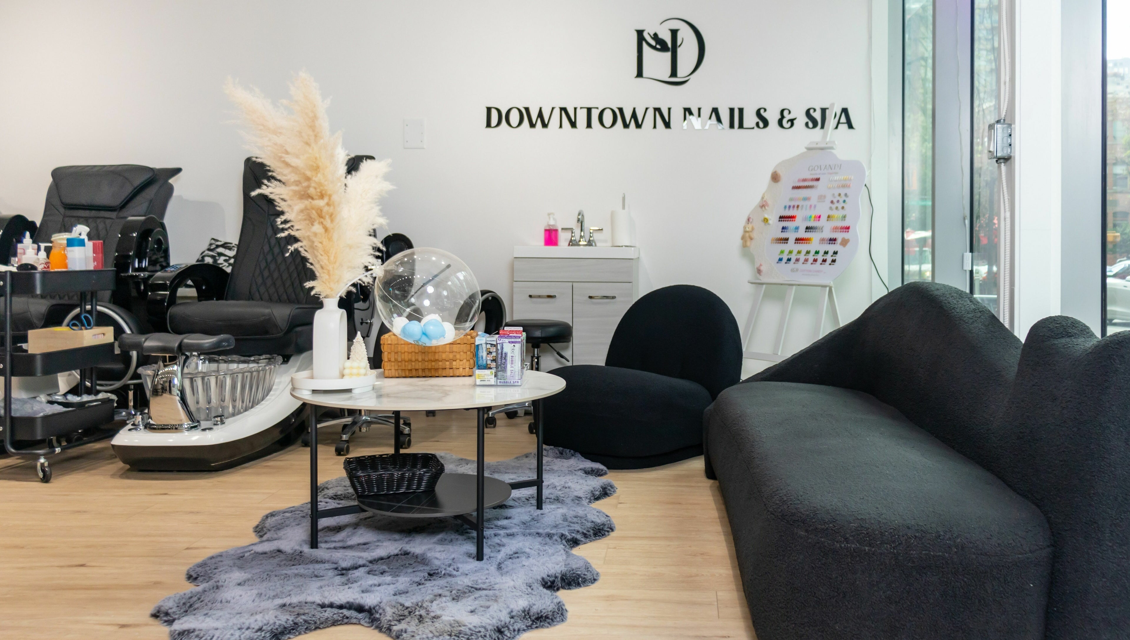 Cozy interior of LND Downtown Nails and Spa in Vancouver, British Columbia, CA featuring modern decor and seating.