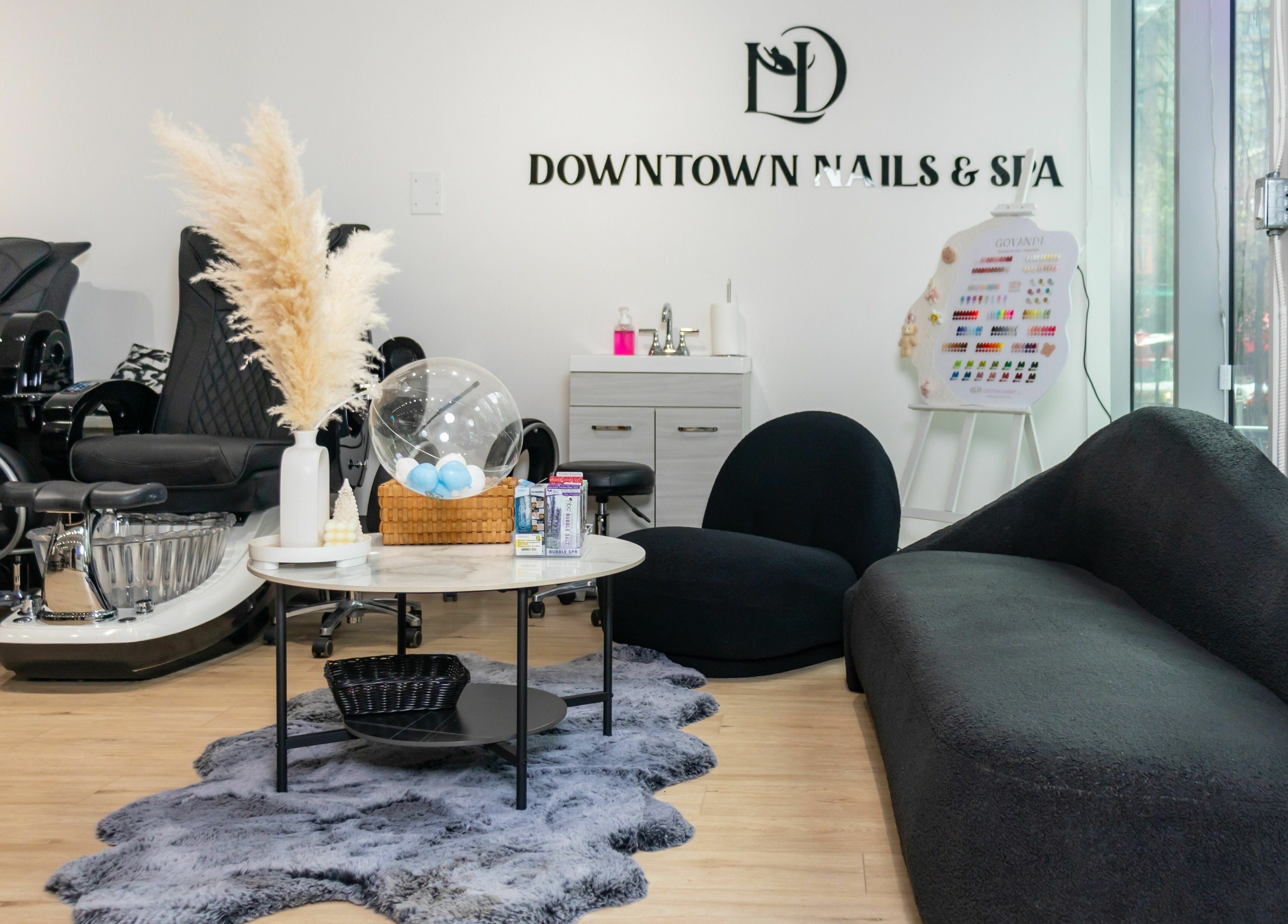 Cozy interior of LND Downtown Nails and Spa in Vancouver, British Columbia, CA featuring modern decor and seating.