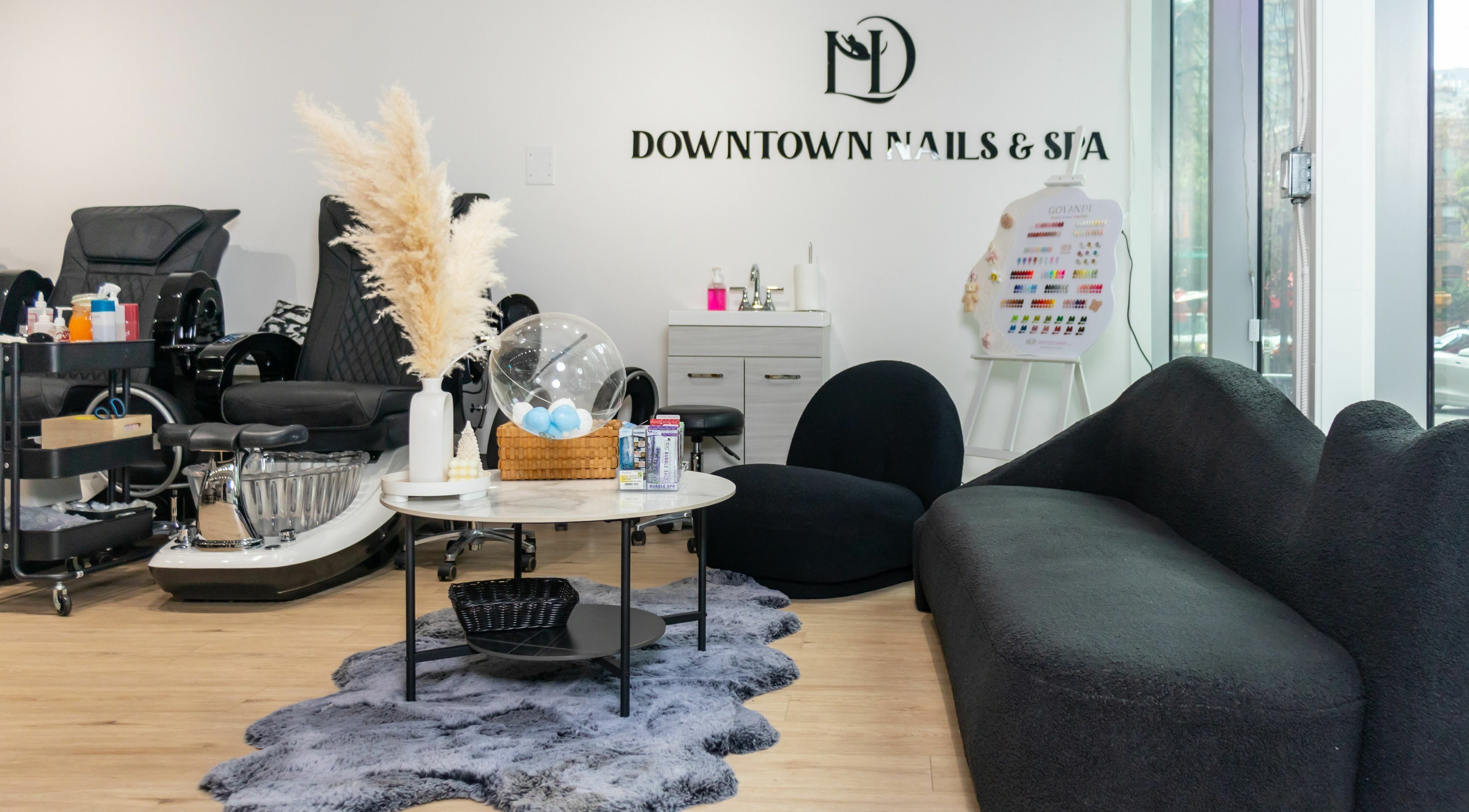 Cozy interior of LND Downtown Nails and Spa in Vancouver, British Columbia, CA featuring modern decor and seating.