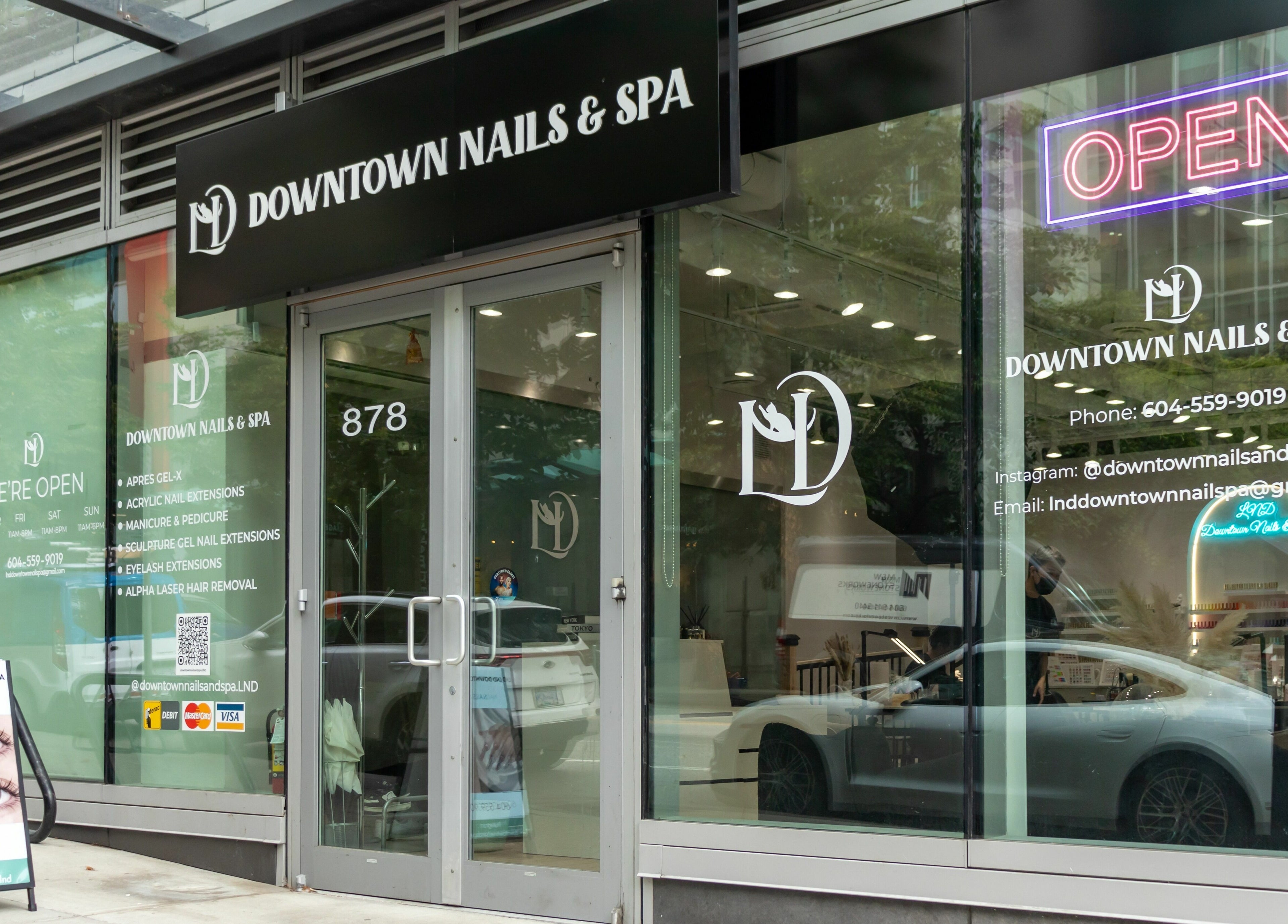 Exterior of LND Downtown Nails and Spa in Vancouver, British Columbia, CA with inviting glass facade.