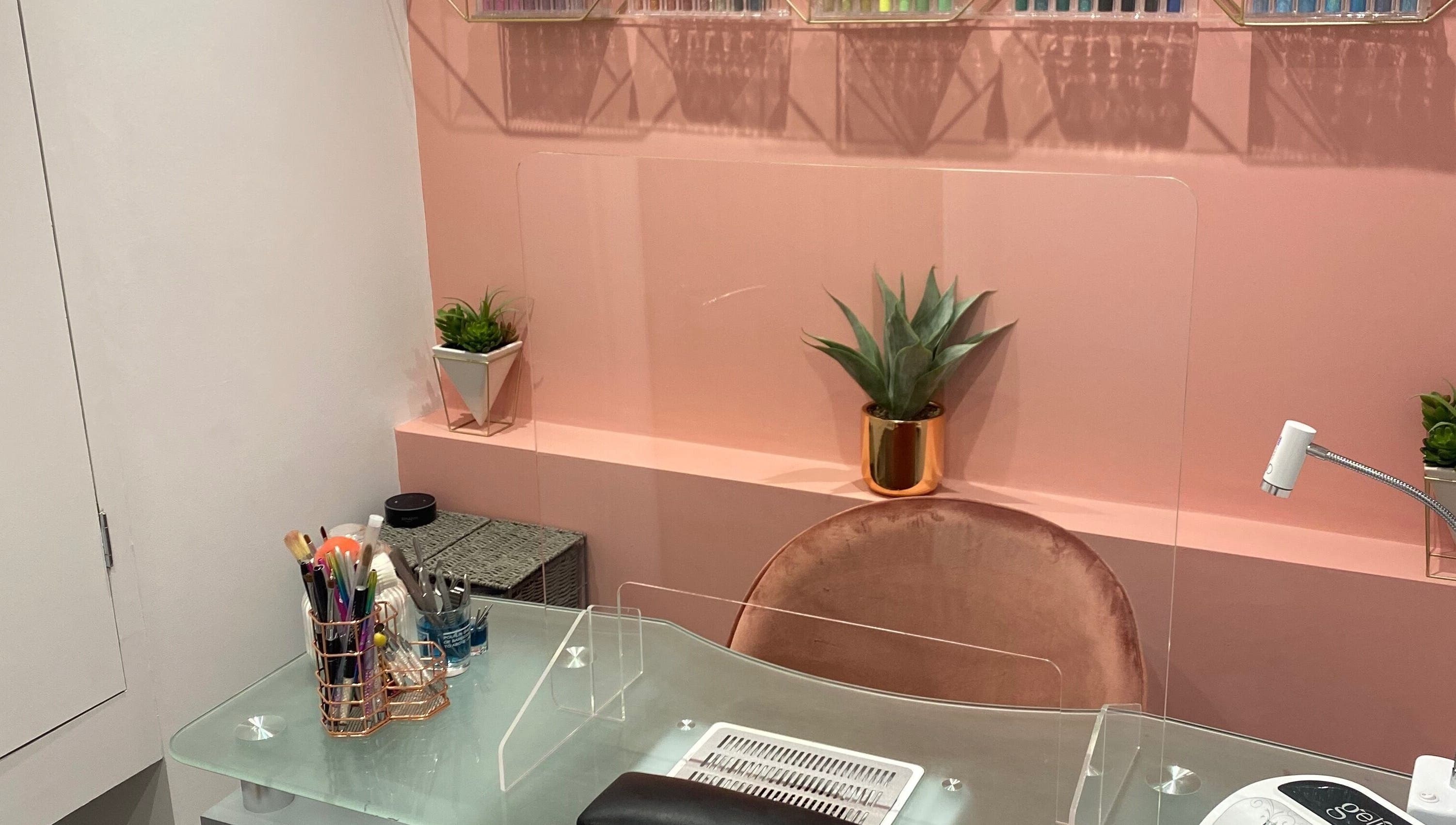 Luxurious Nails interior with stylish nail desk in Ipswich, England, GB featuring chic decor and modern tools.