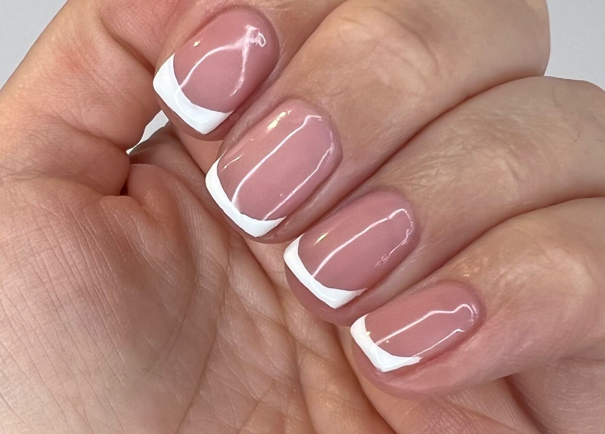 Close-up of French manicure nails at Luxurious Nails, Ipswich, England, GB.