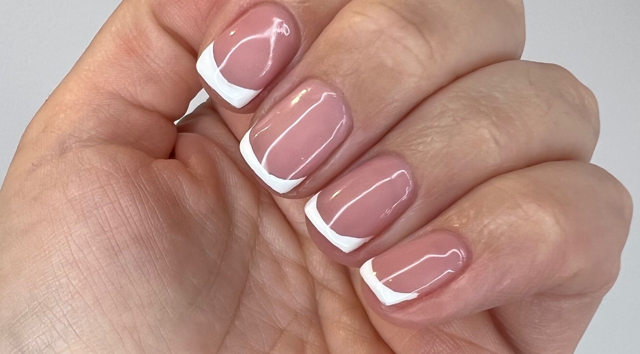 Close-up of French manicure nails at Luxurious Nails, Ipswich, England, GB.