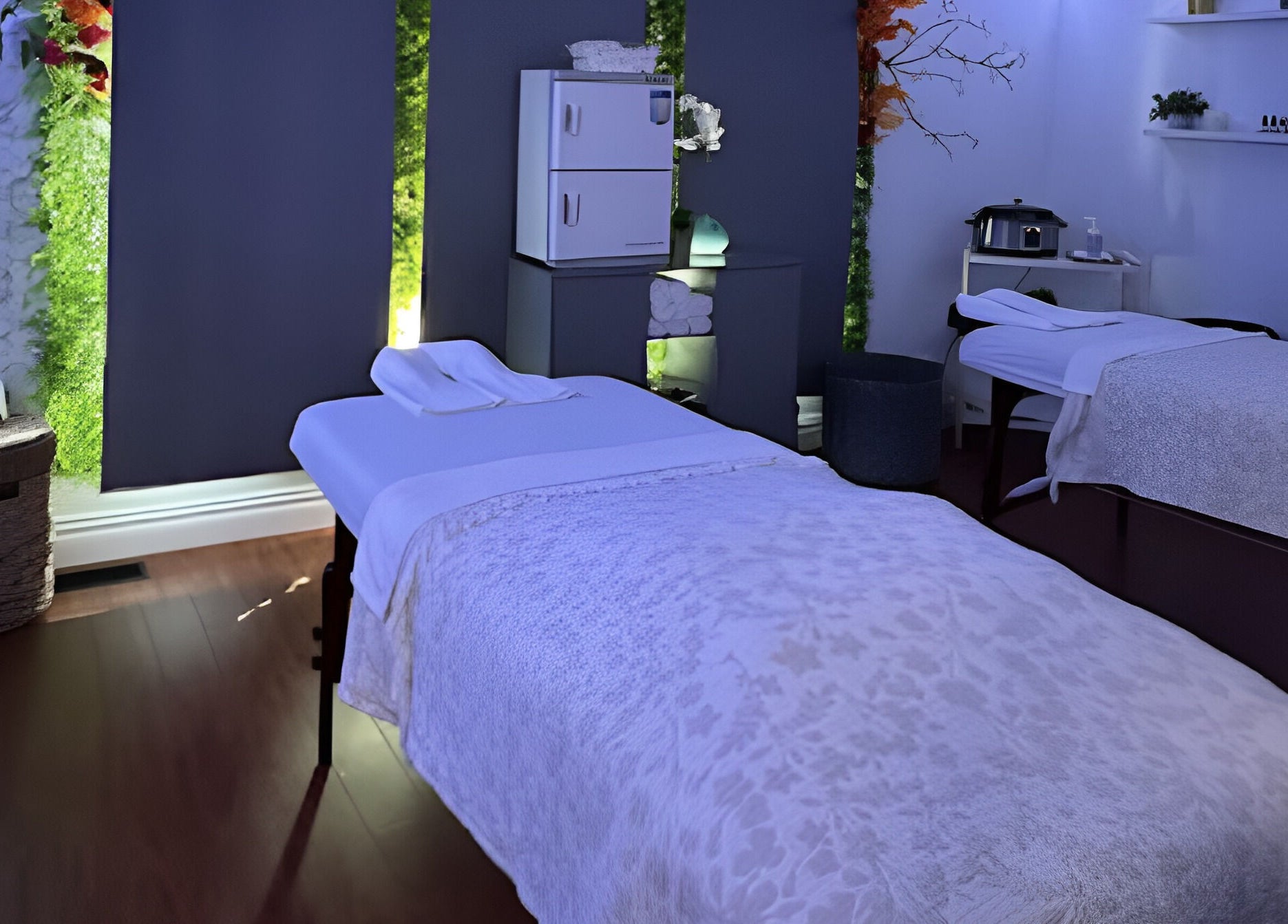 Relaxing treatment room at AG Spa | Nepean Baseline, Ottawa, Ontario, CA with cozy ambiance and massage beds.