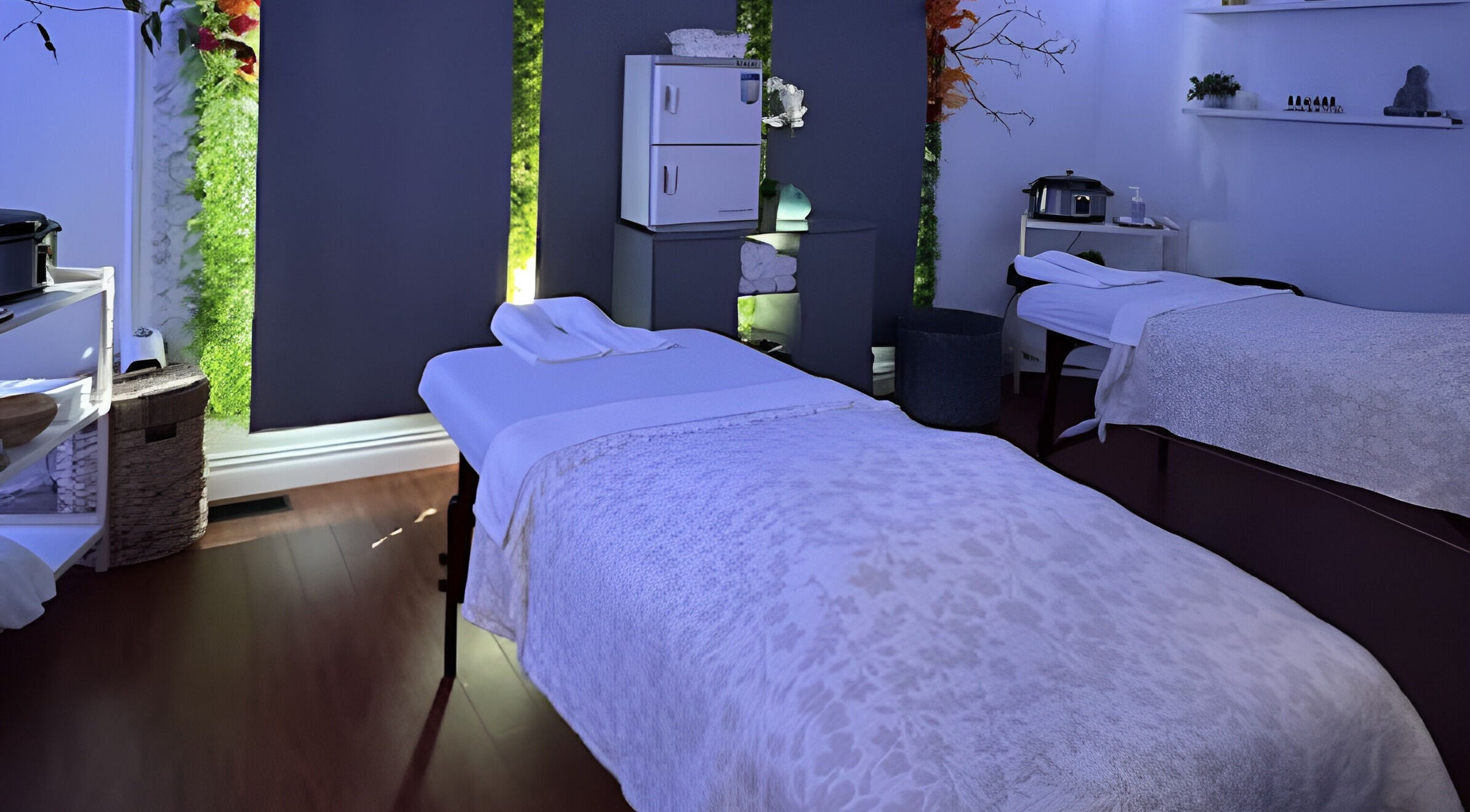 Relaxing treatment room at AG Spa | Nepean Baseline, Ottawa, Ontario, CA with cozy ambiance and massage beds.