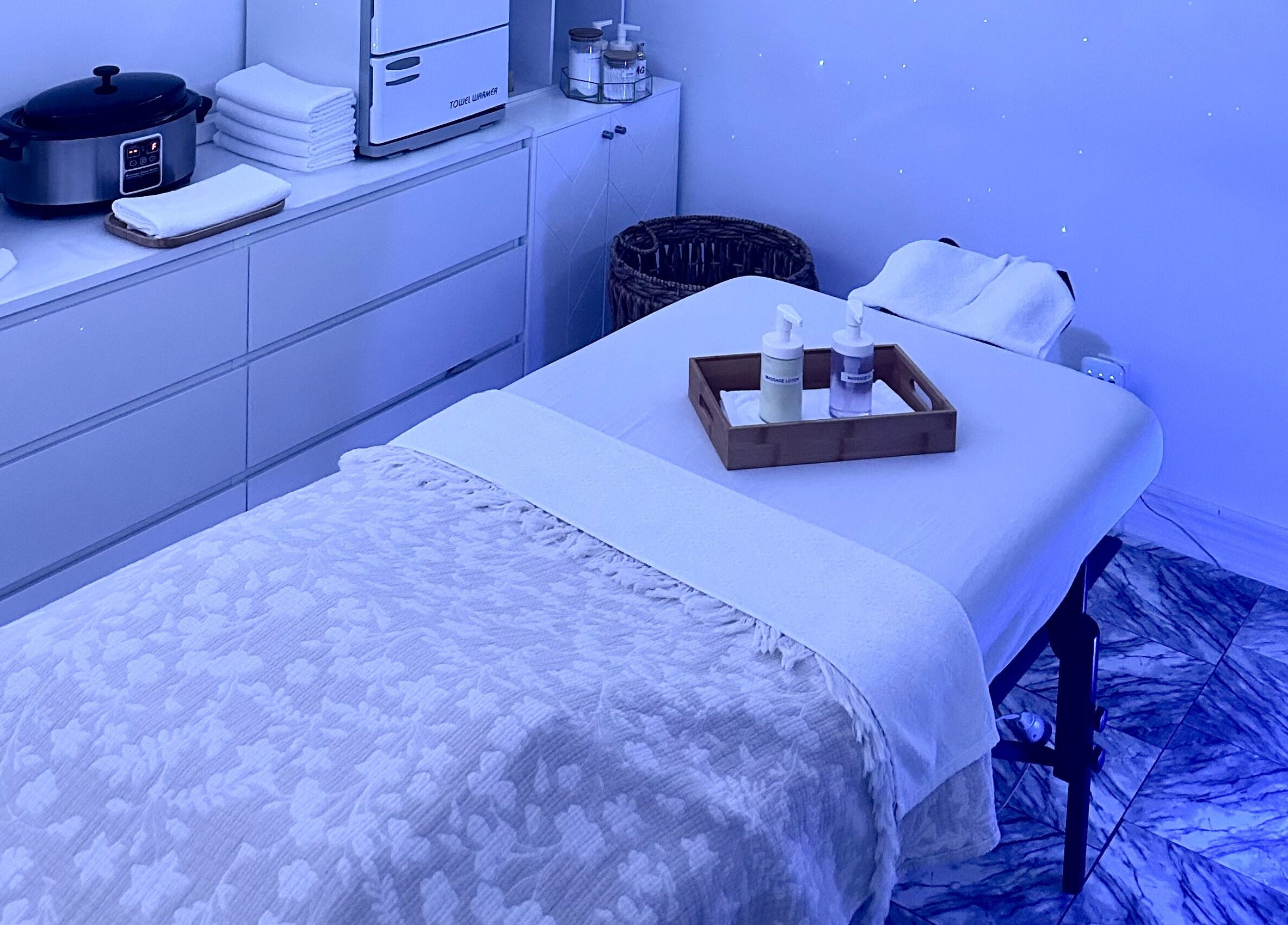 Relaxing massage room at AG Spa | Nepean Baseline in Ottawa, Ontario, CA with soothing lighting and cozy setup.