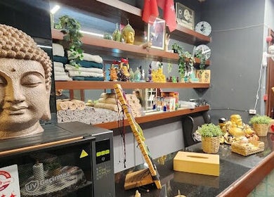 Tranquil interior decor at Royal Foot Massage - Istanbul, featuring Buddha statue and wellness items, İstanbul, TR.