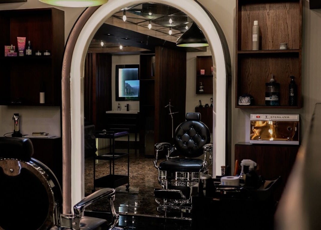 Modern interior of Shavery Salon I شيفري للحلاقة in Al Khobar, Eastern Province, SA, showcasing luxury barber chair.