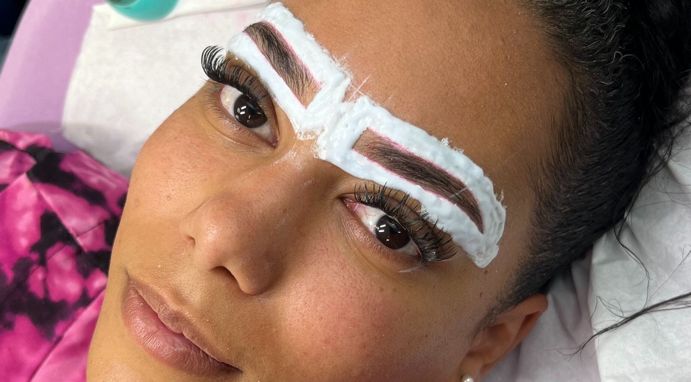 Eyebrow treatment in progress at MHB SALON, Bolton, England, GB. Enhancing natural brows with precision care.