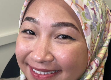 Happy customer at MHB SALON in Bolton, England, GB, displaying freshly styled eyebrows.