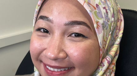 Happy customer at MHB SALON in Bolton, England, GB, displaying freshly styled eyebrows.