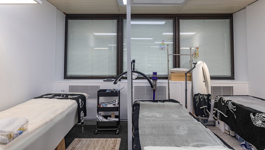 Tranquil treatment room at Monlash, Brisbane City, Queensland, AU showcasing comfortable massage tables.