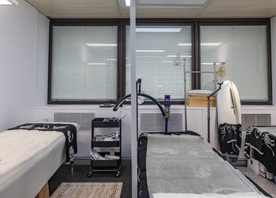 Tranquil treatment room at Monlash, Brisbane City, Queensland, AU showcasing comfortable massage tables.