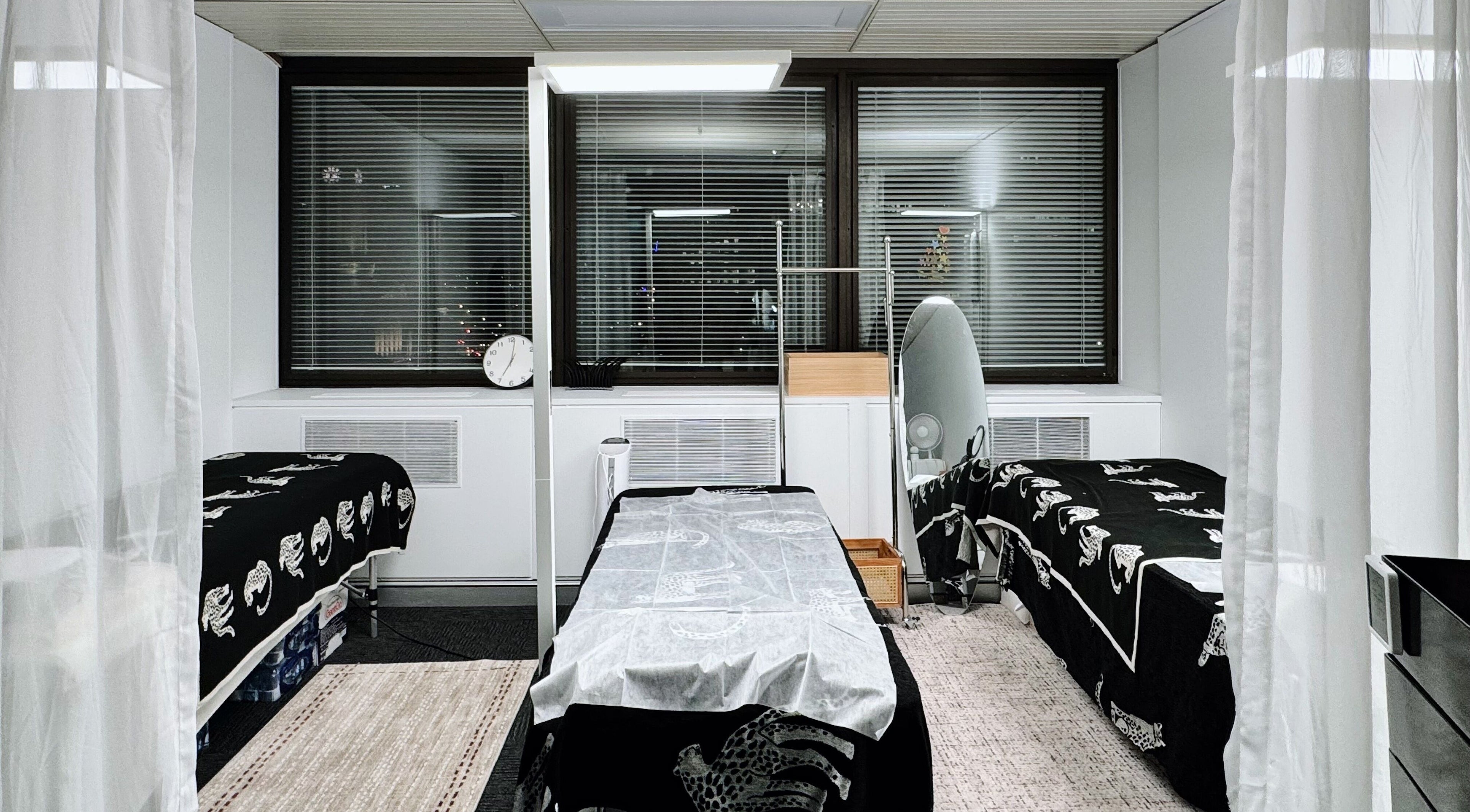 Elegant treatment room at Monlash in Brisbane City, Queensland, AU, featuring cozy beds with cheetah-patterned covers.