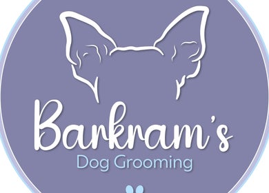 Barkram’s Dog Grooming logo in Foxham, England, GB. Blue background with stylized dog illustration.