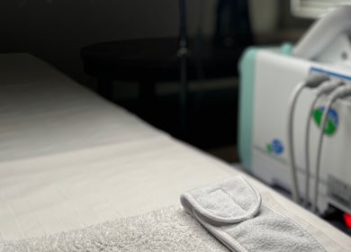 Relaxing treatment setup at Court by Beauty, Dartford, England, GB showcasing a modern therapy bed.