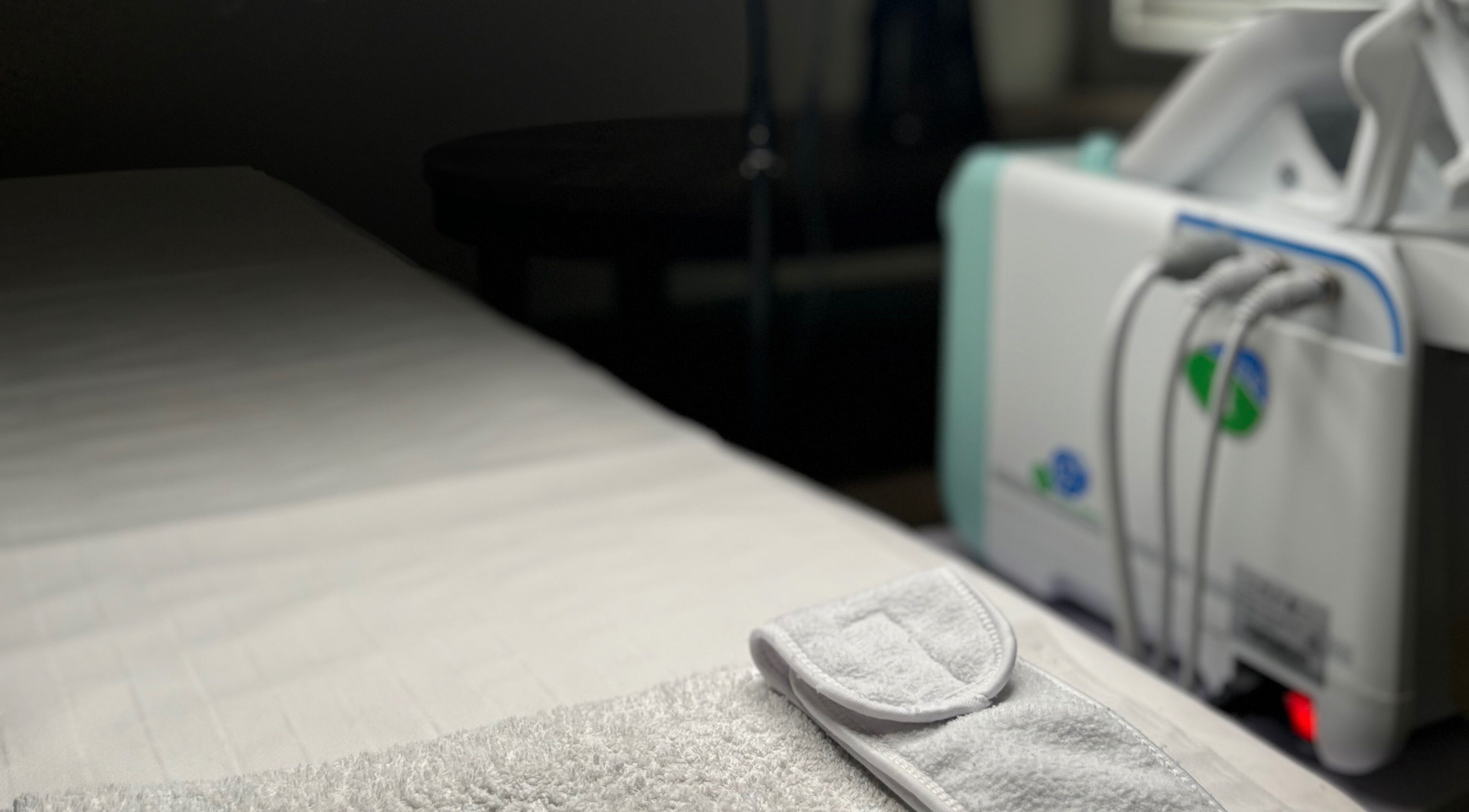 Relaxing treatment setup at Court by Beauty, Dartford, England, GB showcasing a modern therapy bed.