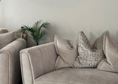 Chic lounge area at Court by Beauty, Dartford, England, GB with plush sofas and stylish cushions.