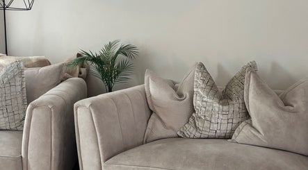 Chic lounge area at Court by Beauty, Dartford, England, GB with plush sofas and stylish cushions.