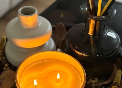 A lit candle and diffuser at Court by Beauty, Dartford, England, GB creating a tranquil ambiance.