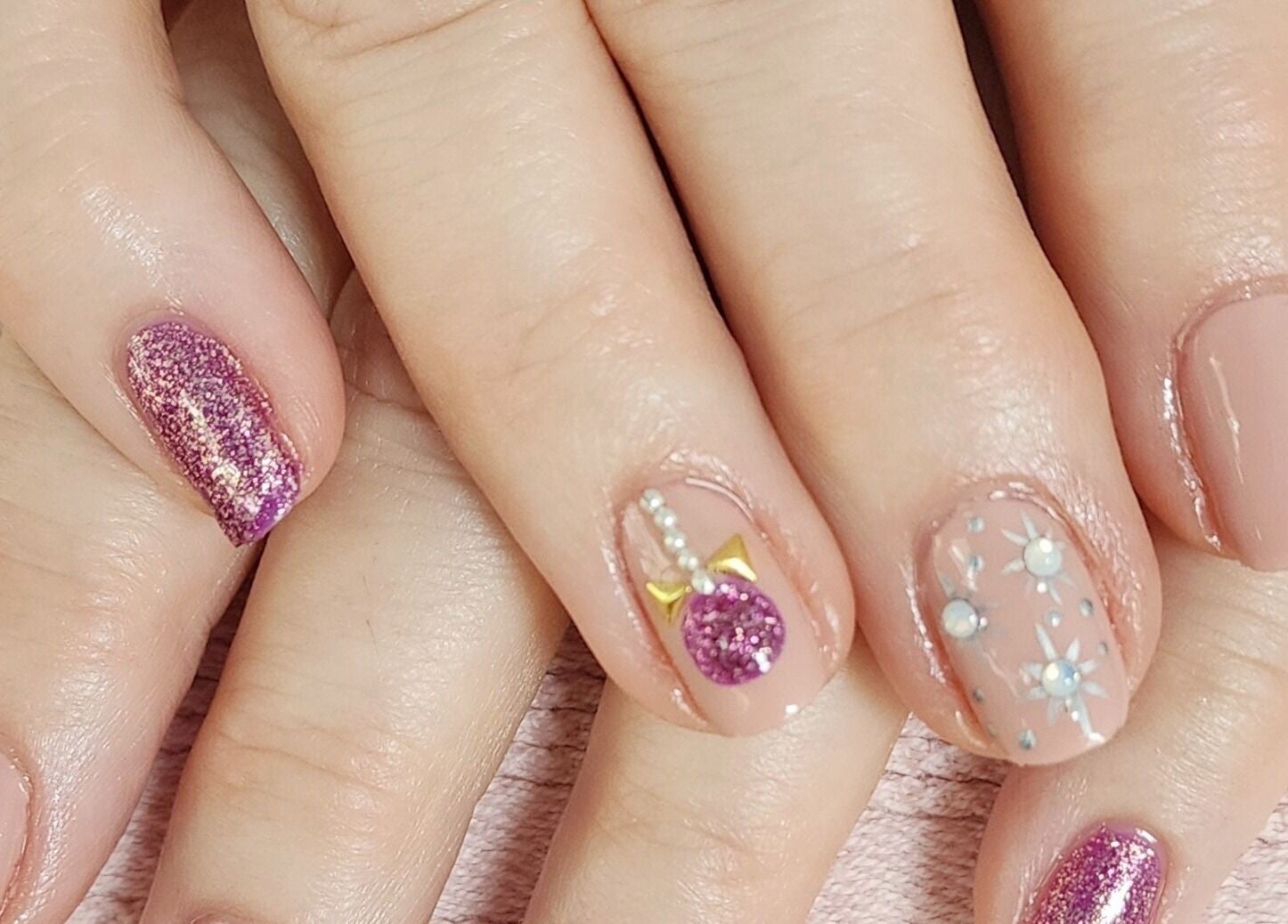Decorative nail art with glitter and bows at Tactical Nails, Landsborough, Queensland, AU.