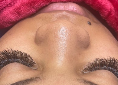 Close-up of a client enjoying eyelash extensions at U’niquely Touched by LJC in Celina, Texas, US.
