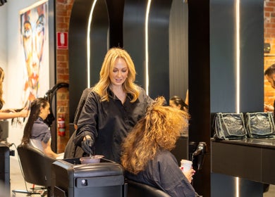 Stylists at Eran Benn in Melbourne, Victoria, AU providing hair services in a modern salon setting.