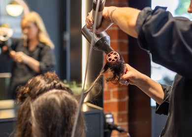 Professional hair styling at Eran Benn, Melbourne, Victoria, AU salon showcasing expert care.