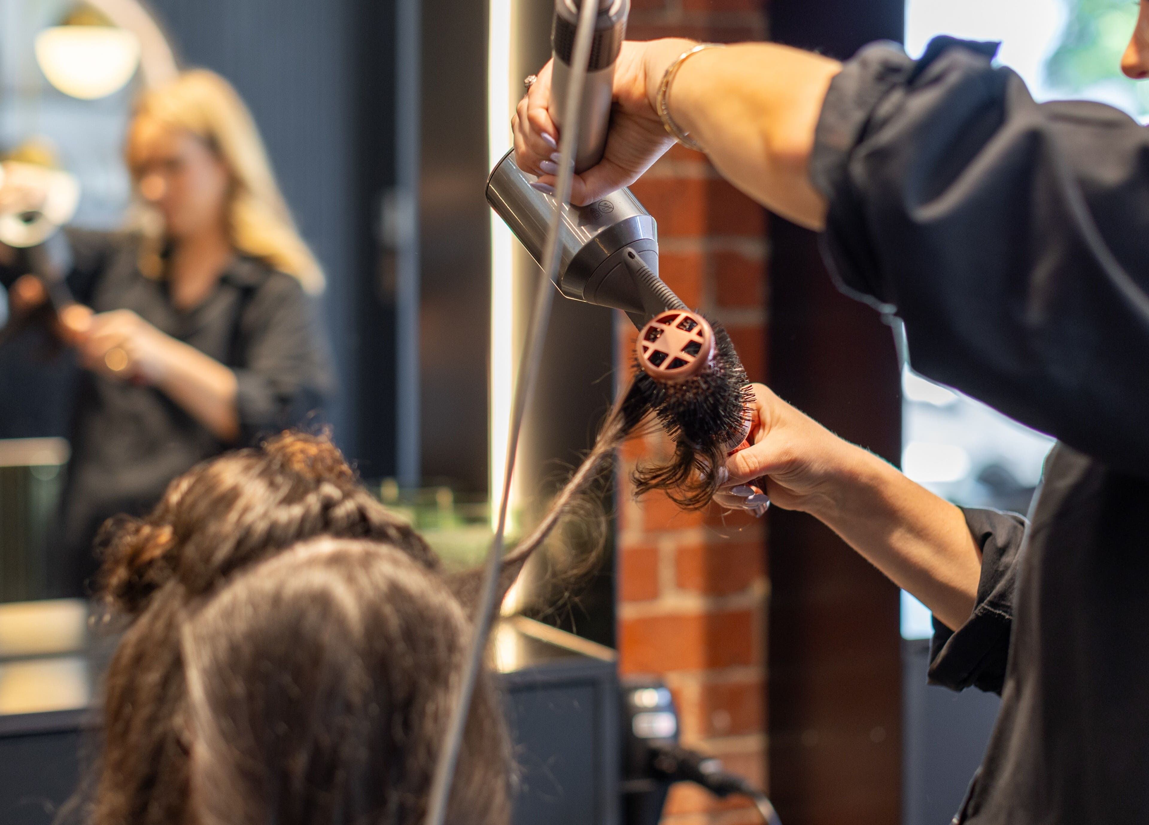 Professional hair styling at Eran Benn, Melbourne, Victoria, AU salon showcasing expert care.