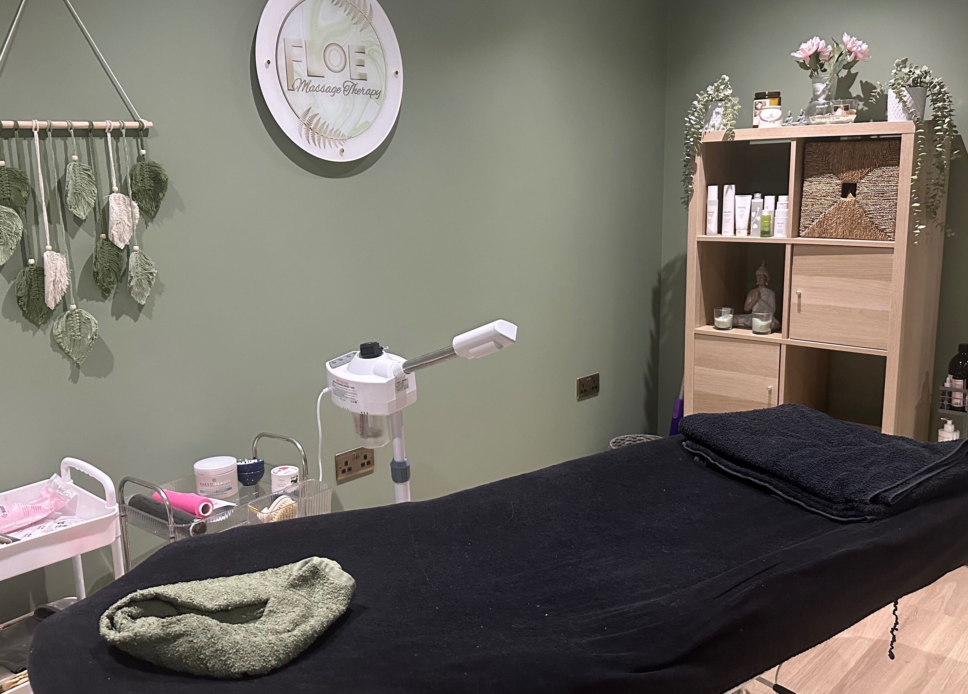 Cozy massage room at FLoE Massage Therapy in Sutton, England, GB with decor and equipment for relaxation.