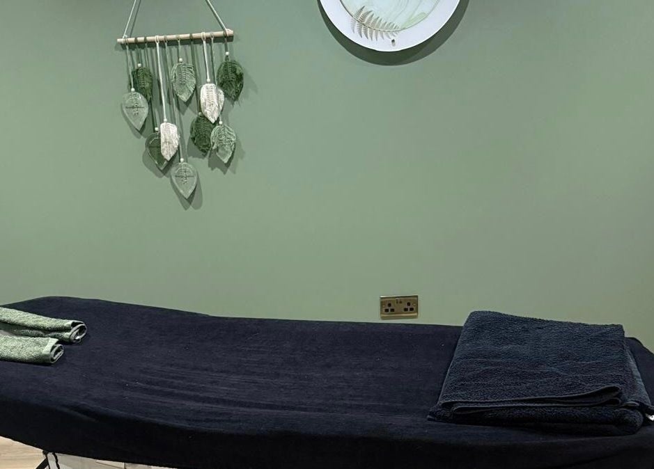 Relaxing massage room at FLoE Massage Therapy, Sutton, England, GB featuring a serene table setup.
