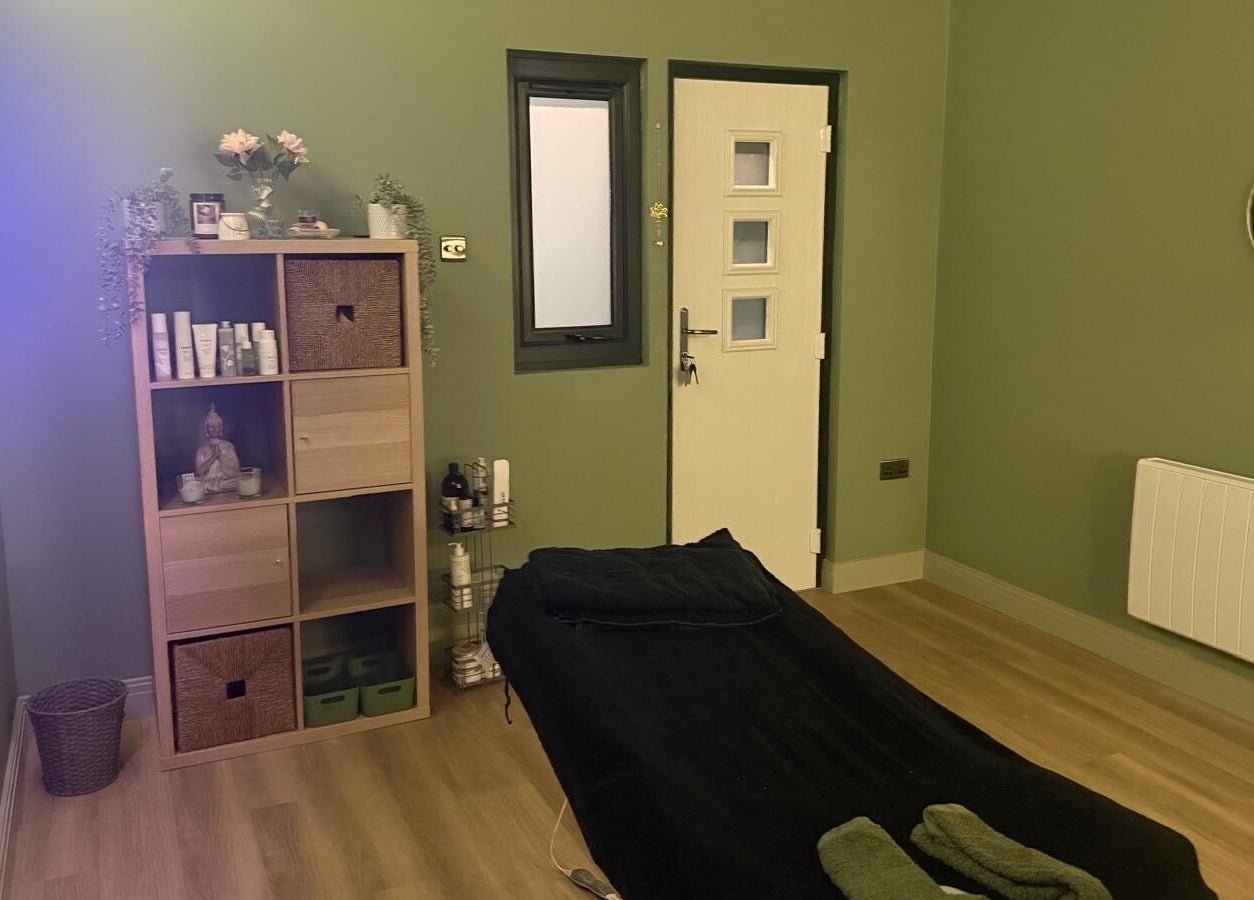 Relaxing massage room at FLoE Massage Therapy, Sutton, England, GB, with soothing decor and ambient lighting.