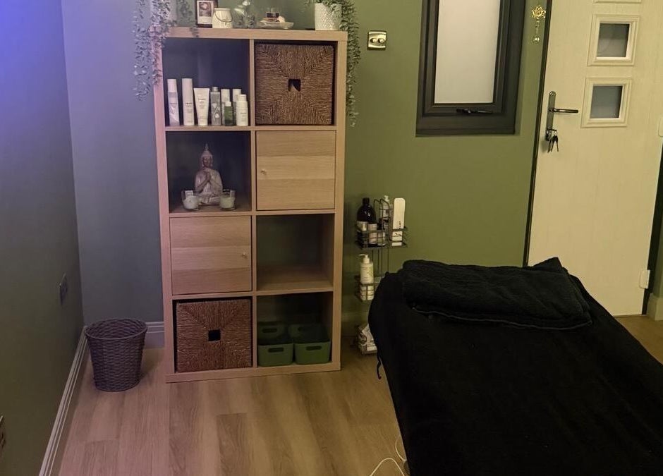 Calm massage room at FLoE Massage Therapy, Sutton, England, featuring a soothing green decor and cozy ambiance.