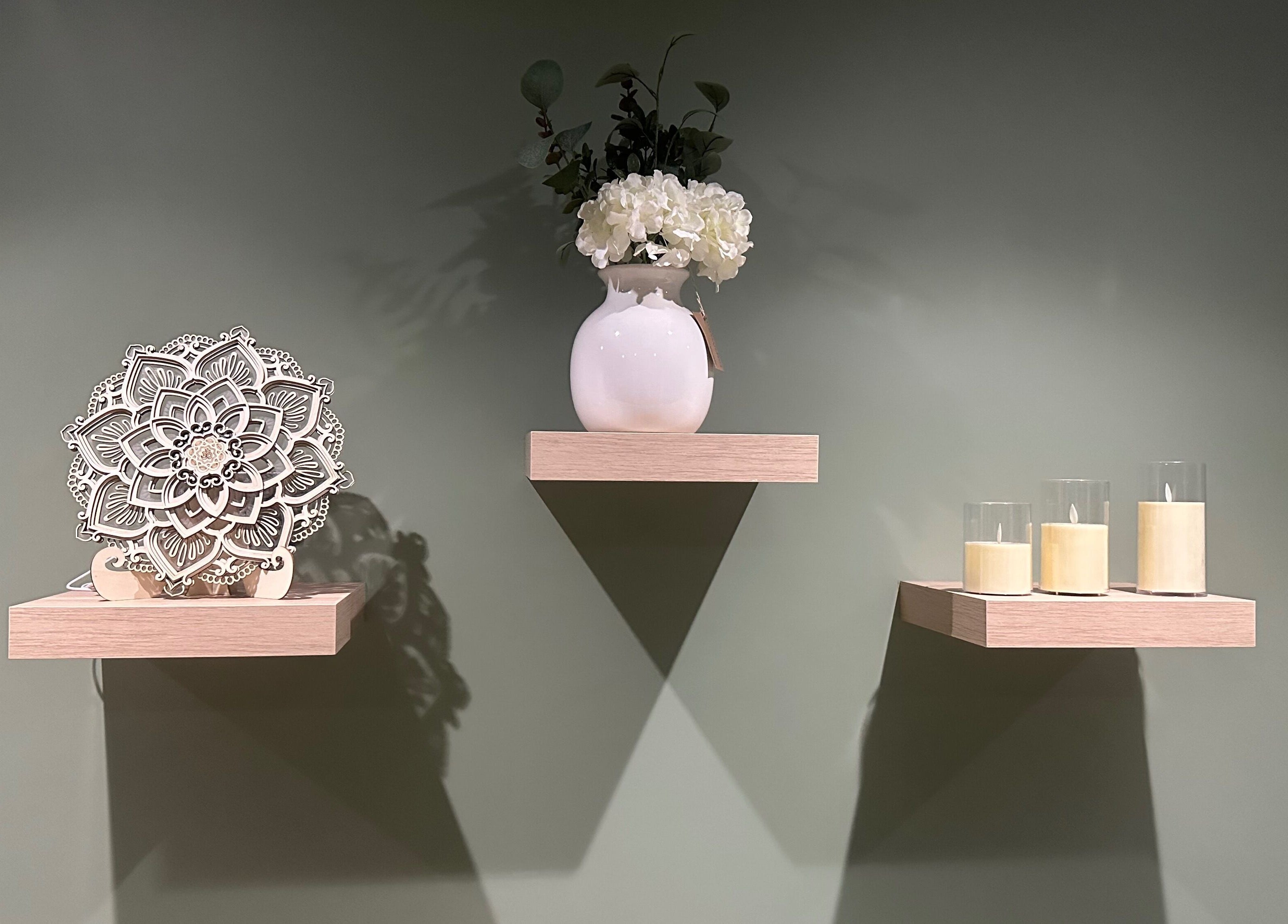 Elegant wall shelves with decor at FLoE Massage Therapy, Sutton, England, GB. Experience relaxation and style.